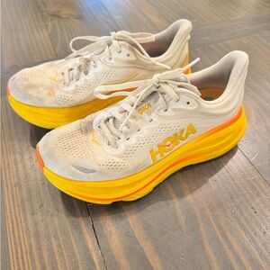 Hoka White Running Shoes with Yellow and Orange Midsole